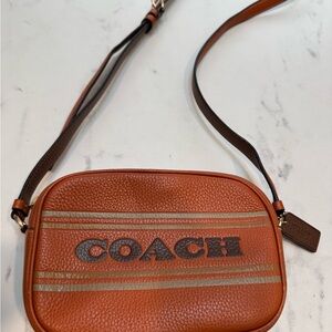 Coach camera bag. Rich orange color.